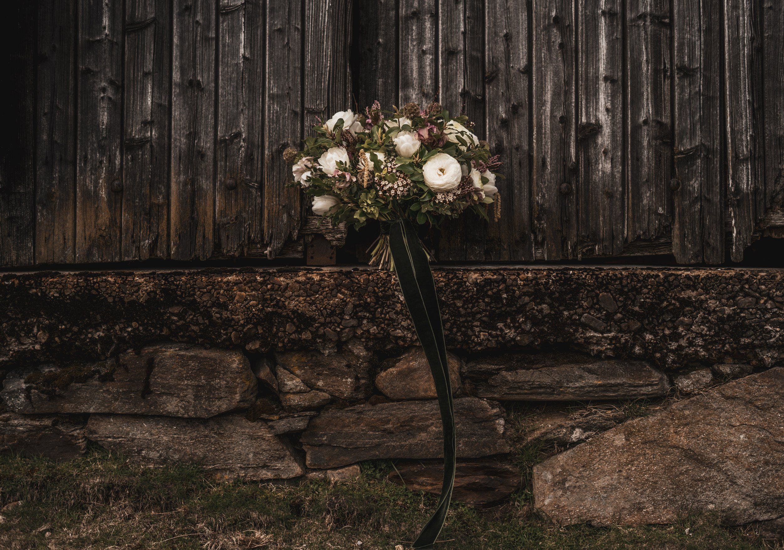 Bouquet resting on an barn